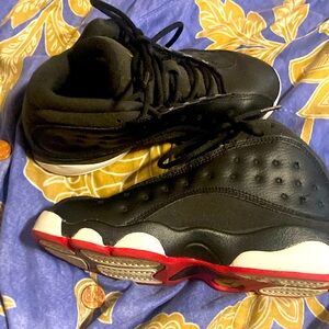 Black, white, red and yellow Jordan 13 with chrome 23 bubble logo size 2y